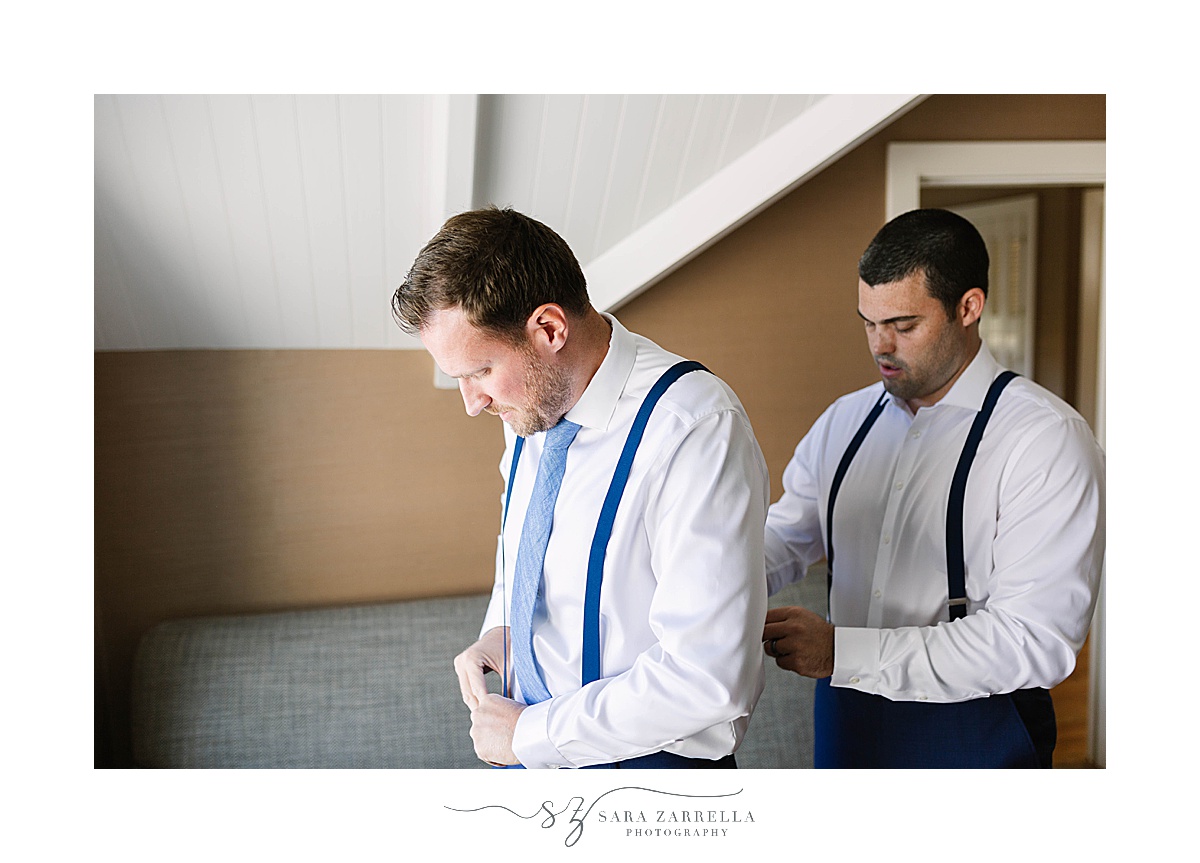 groomsman helps groom prepare for Castle Hill Inn Wedding