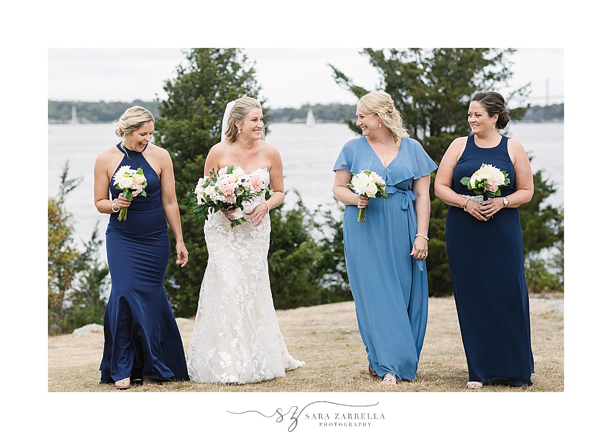 bride walks with bridesmaids in bleu gowns