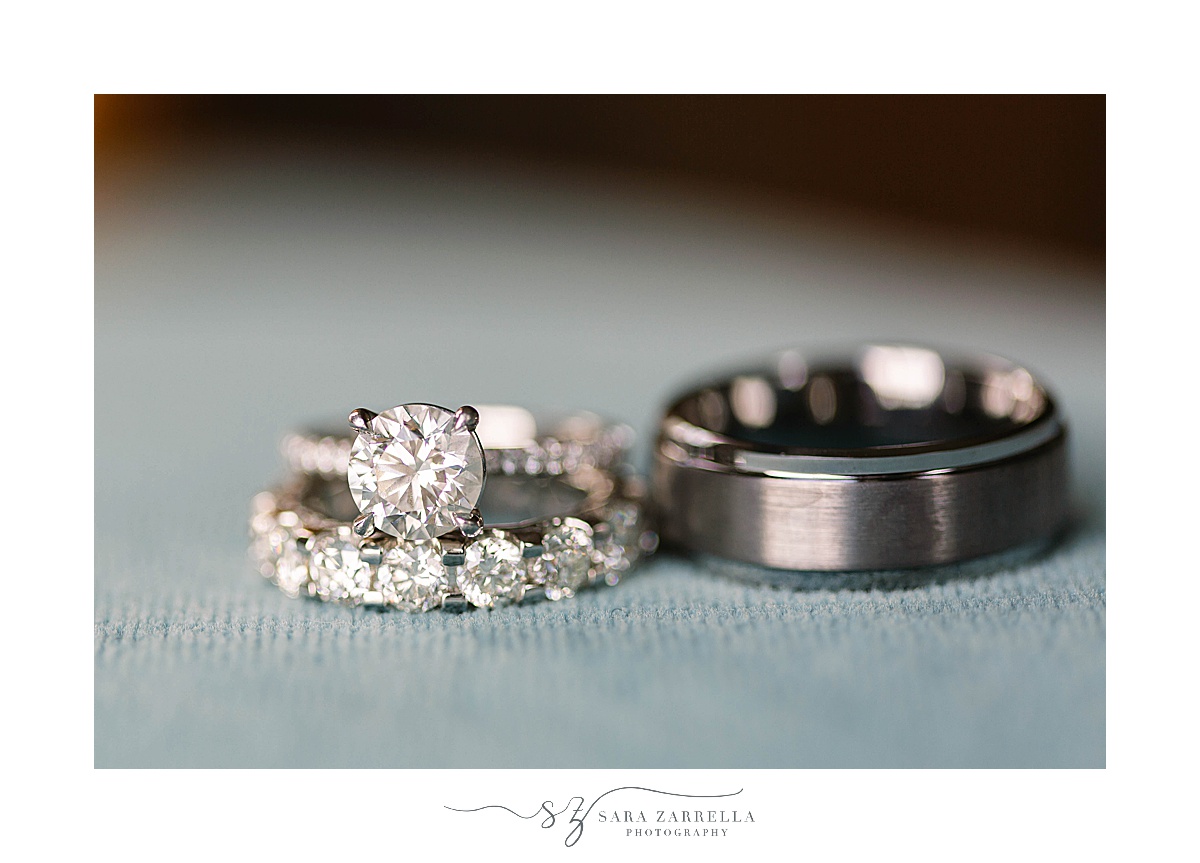 wedding rings on pale blue floor photographed by Sara Zarrella Photography