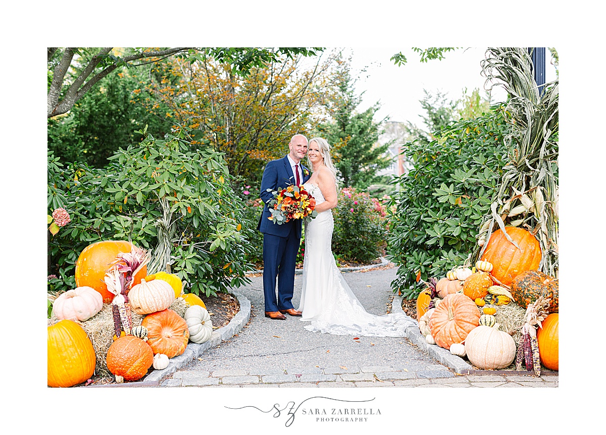 newlyweds pose on fall wedding day in Newport RI