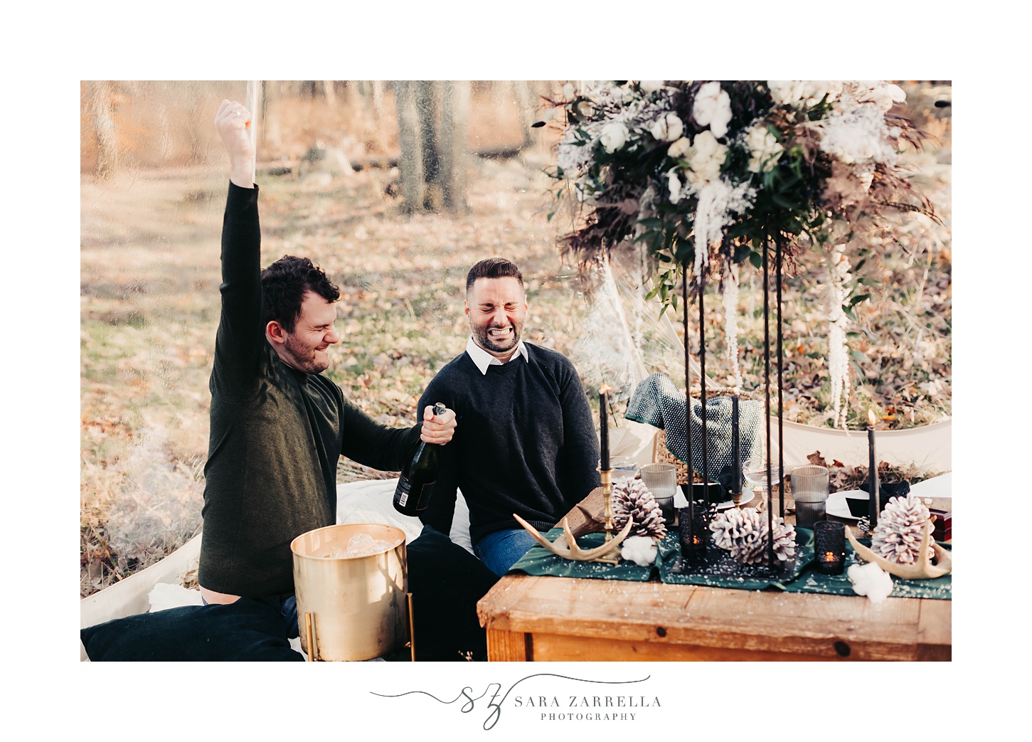 groom cheers during cozy winter proposal at Gerald's Farm