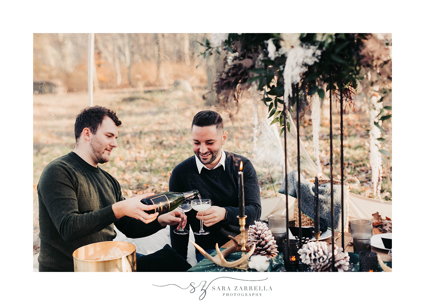 fiance pours champagne for boyfriend during cozy winter proposal