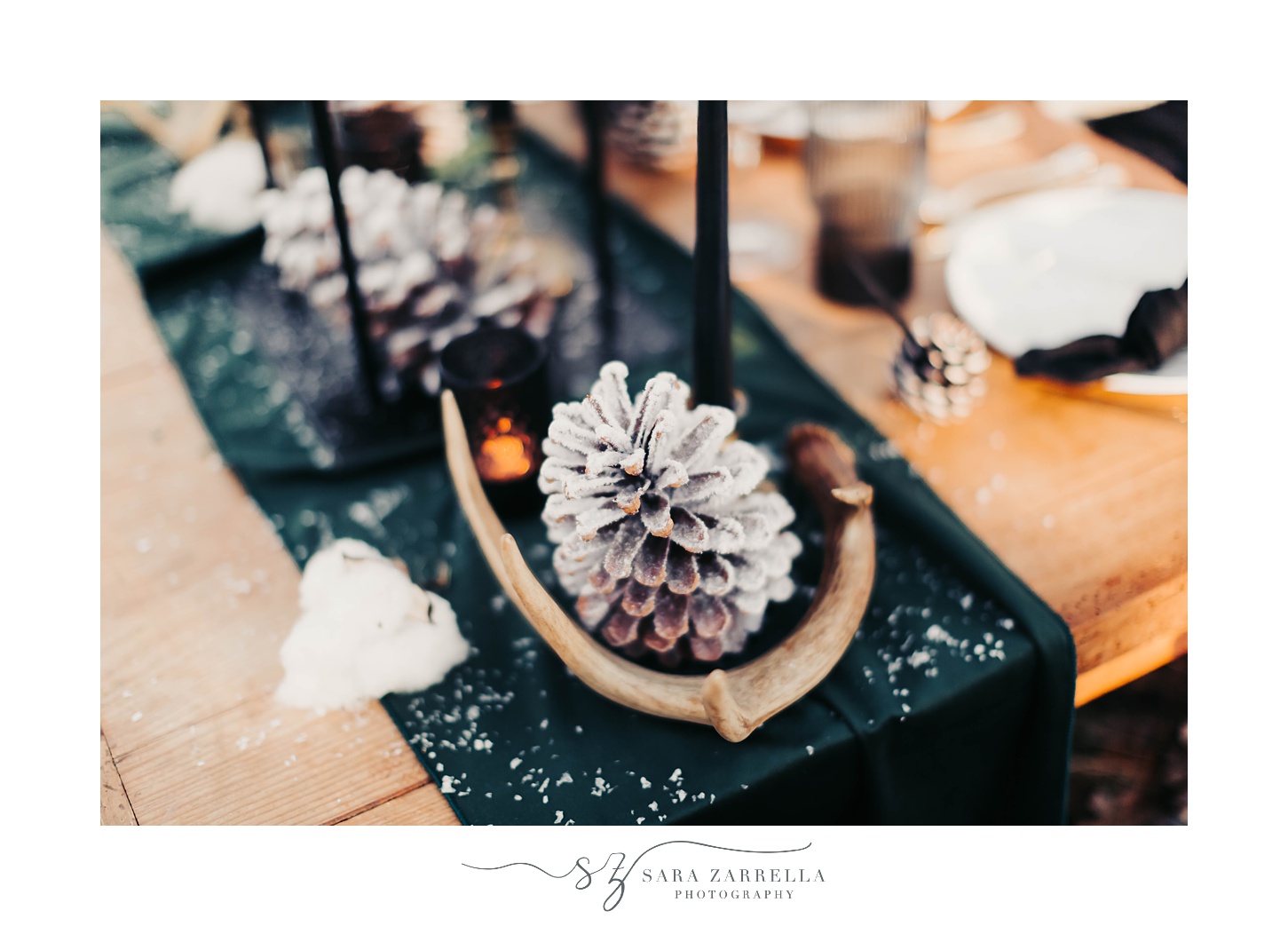winter tablescape with emerald green runner and pinecones