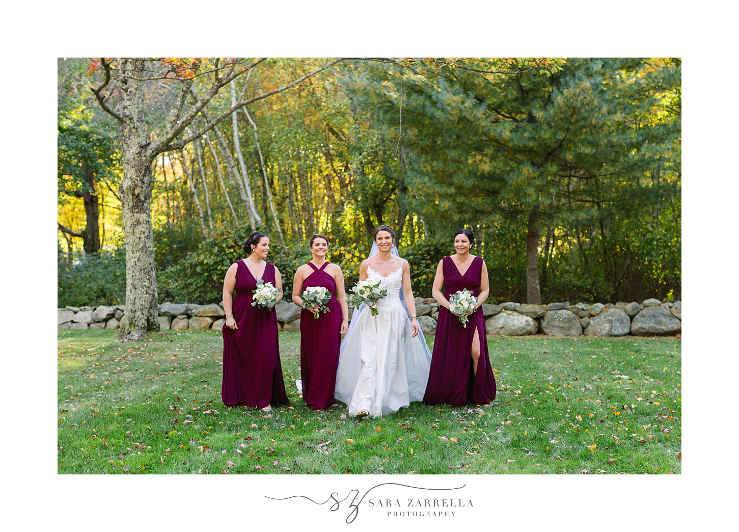bride walks with three bridesmaids in cranberry gowns at Gerald's Farm
