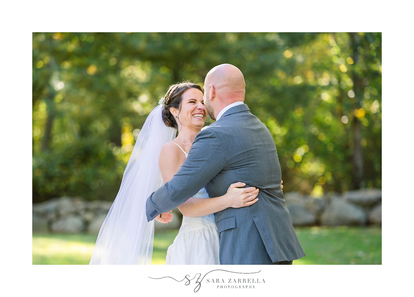 bride and groom hug during wedding photos in Rhode Island