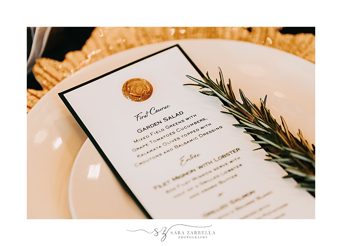 place setting with menu with gold wax seal