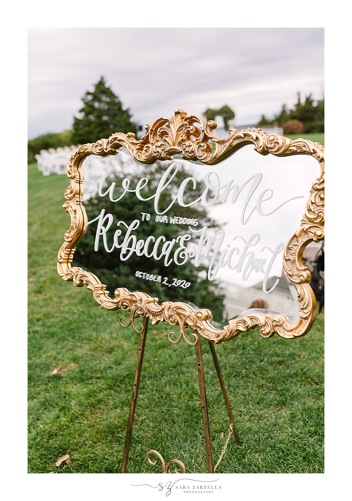 welcome sign on gold and glass 