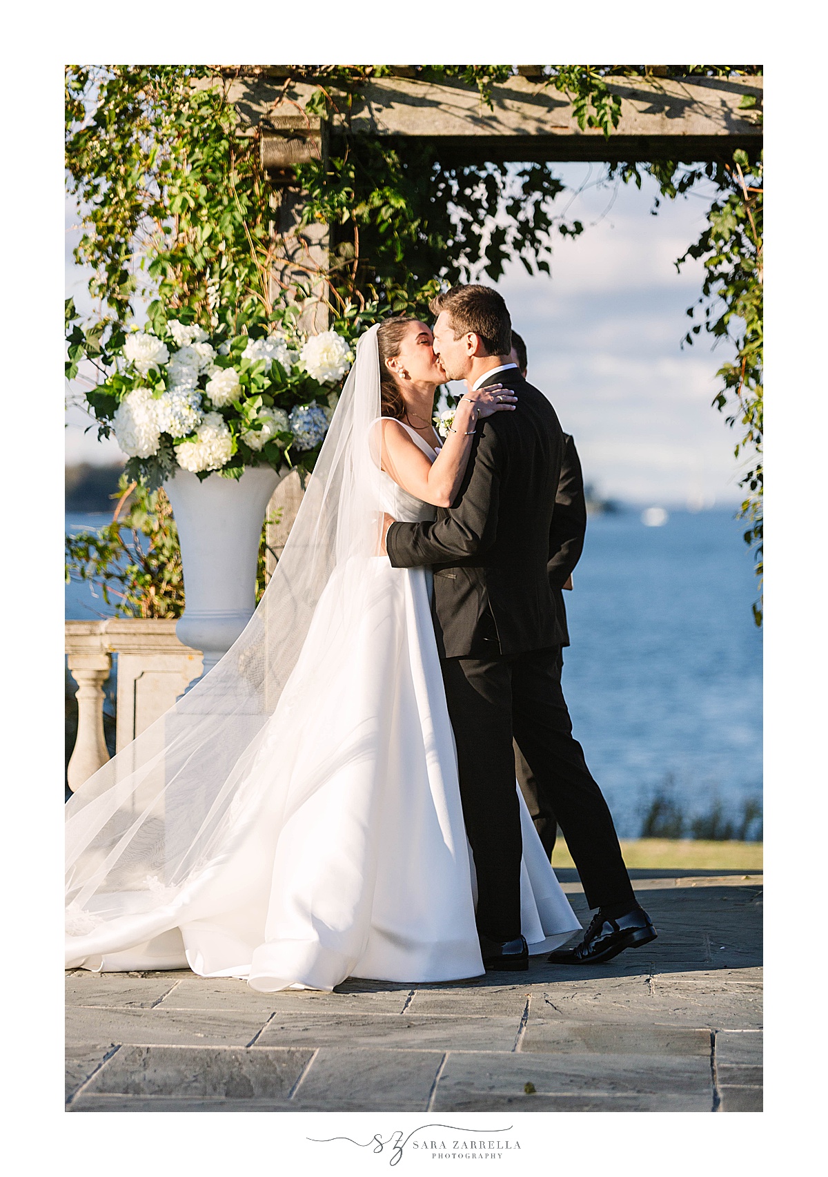 newlyweds kiss during Castle Hill Inn microwedding ceremony
