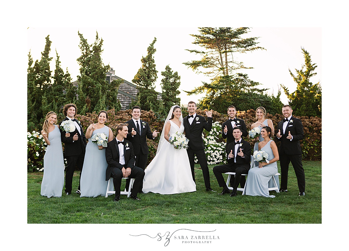 wedding party sits in garden at Castle Hill Inn
