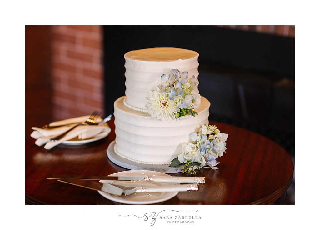 simple wedding cake with two tiers and floral accents for Castle Hill Inn microwedding