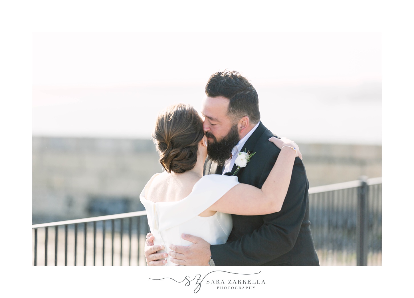 groom whispers to bride during first look in Newport RI