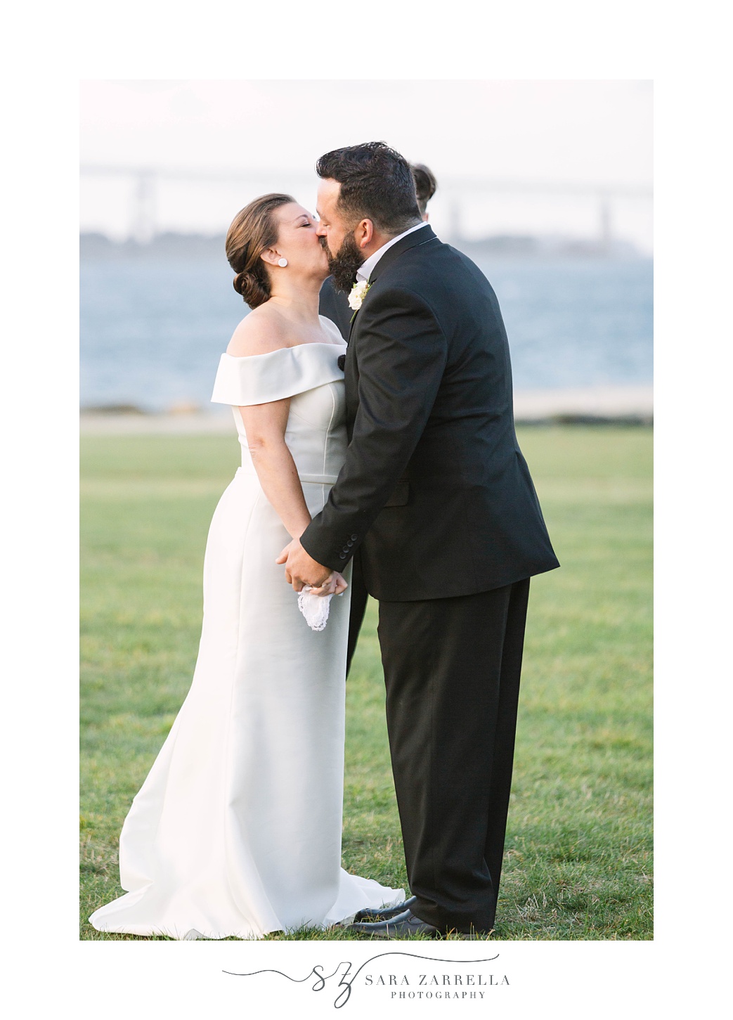 bride and groom kiss after ceremony at Fort Adams