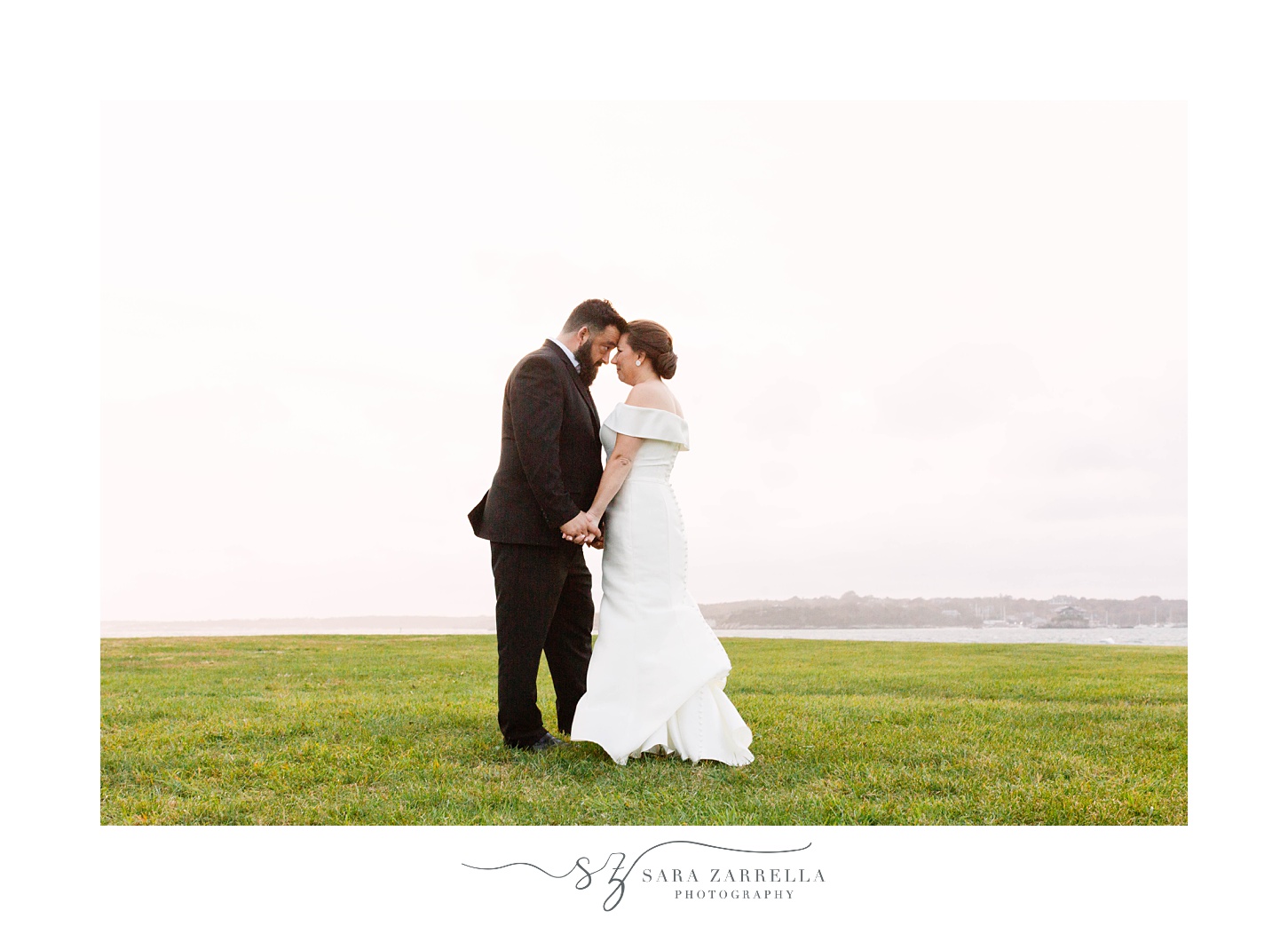 sunset wedding portraits on hill outside Fort Adams
