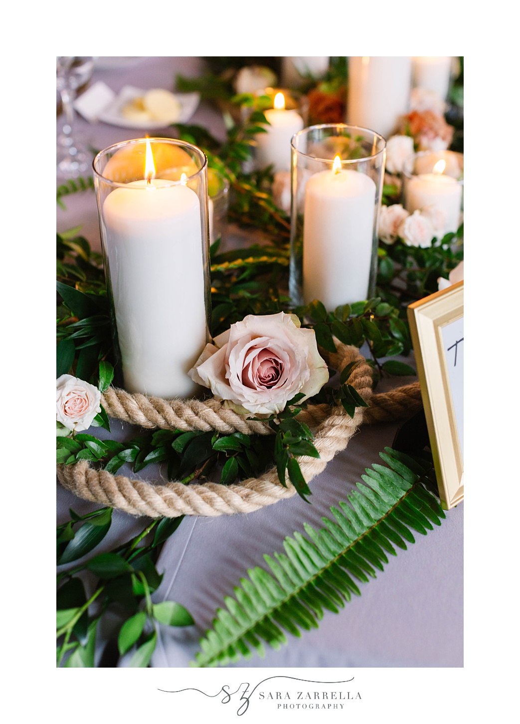 elegant table runner with candles and greenery at Fort Adams