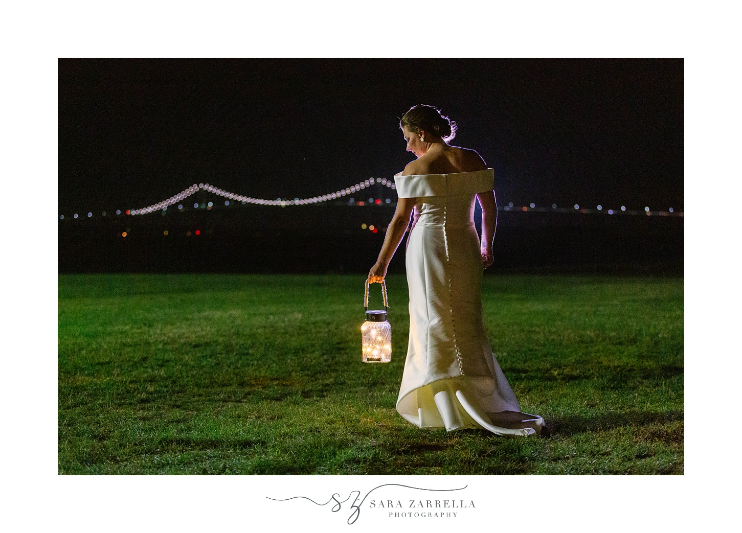 bride holds memory lamp outside Fort Adams