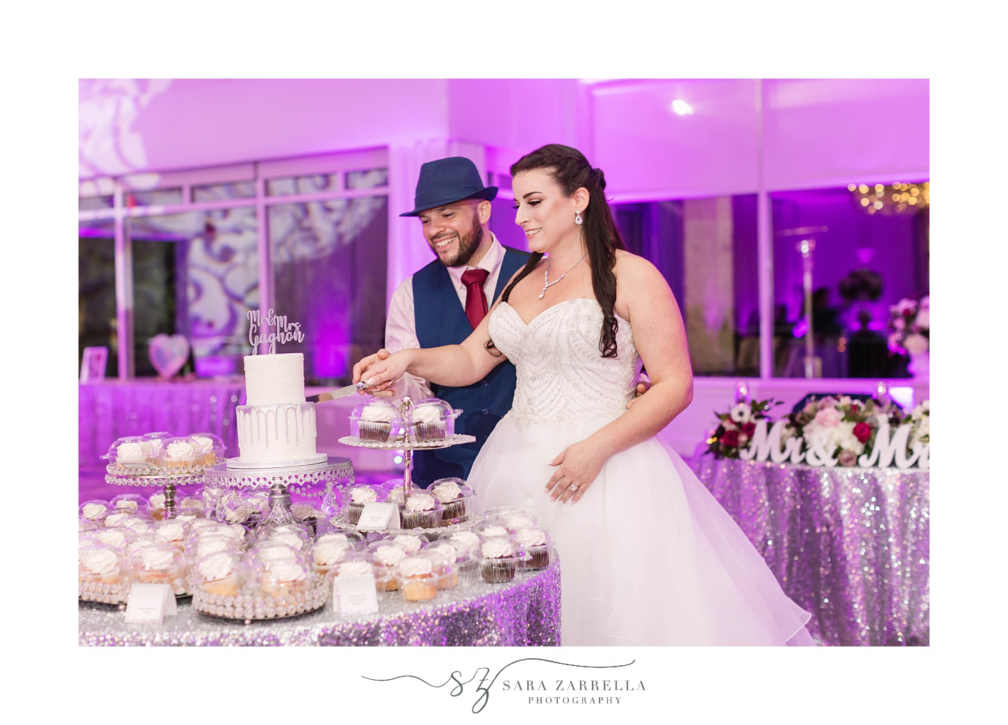 newlyweds cut wedding cake during Kirkbrae Country Club reception