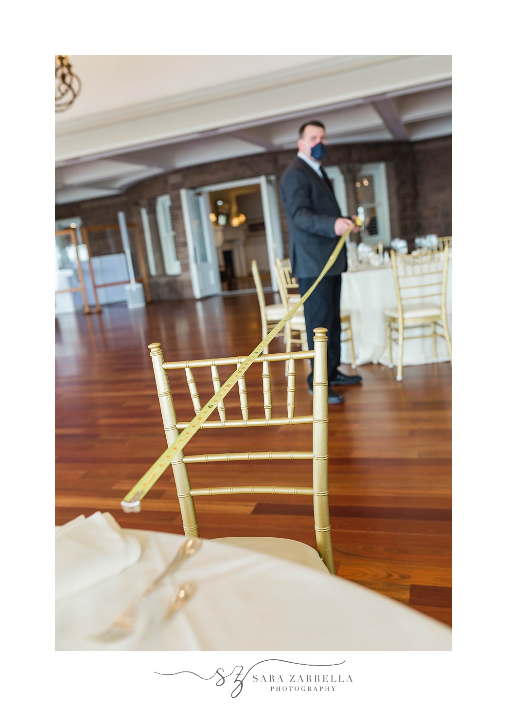 venue measures distance between tables during RI wedding reception