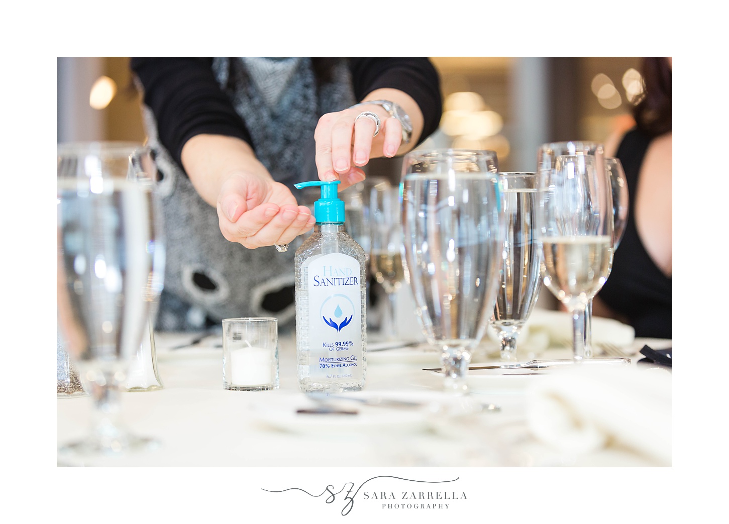 staff uses hand sanitizer before working Mock Wedding at OceanCliff