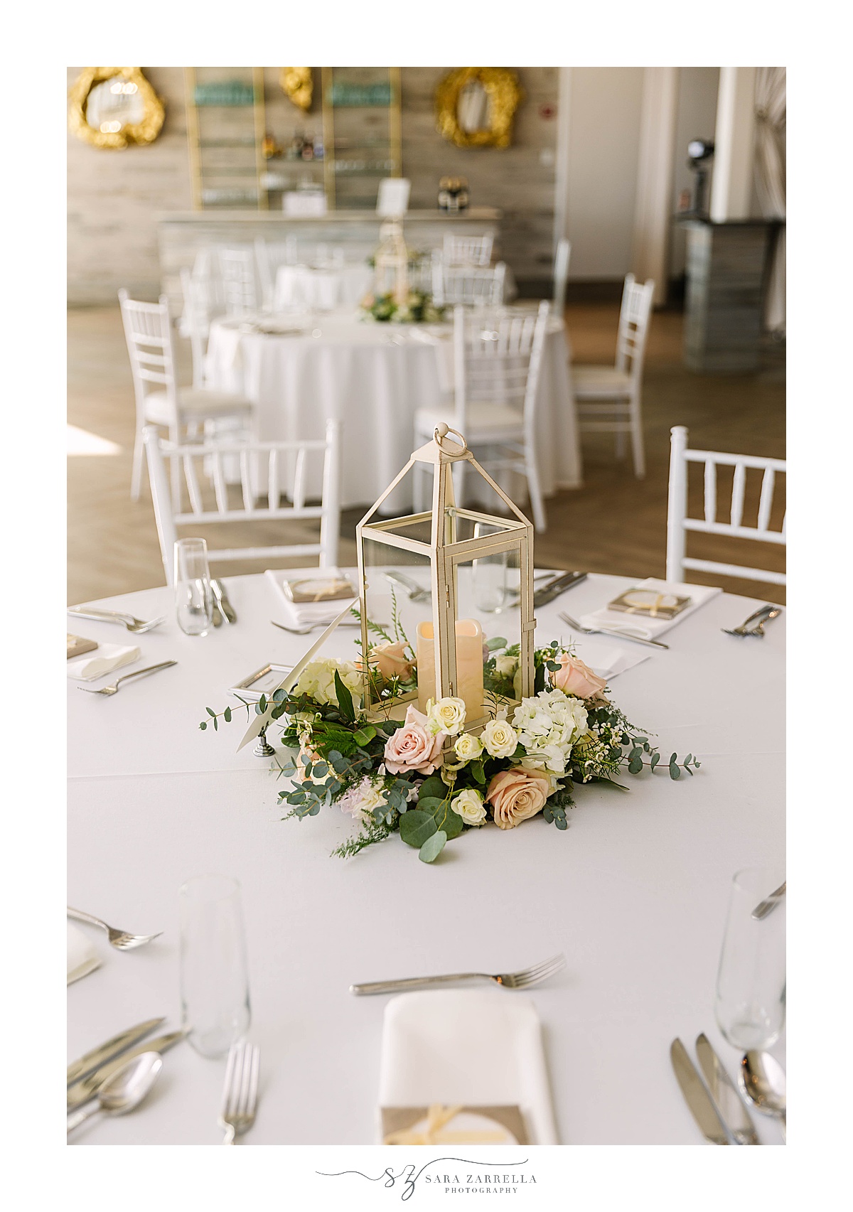 centerpieces with lanterns and pastel roses
