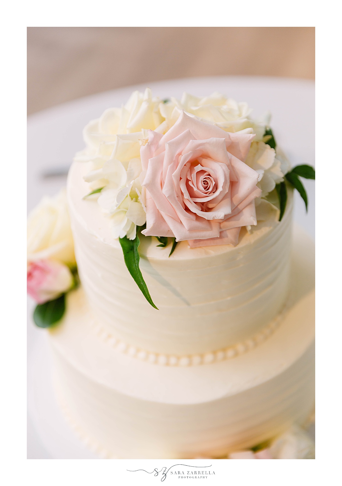 wedding cake with florals on top