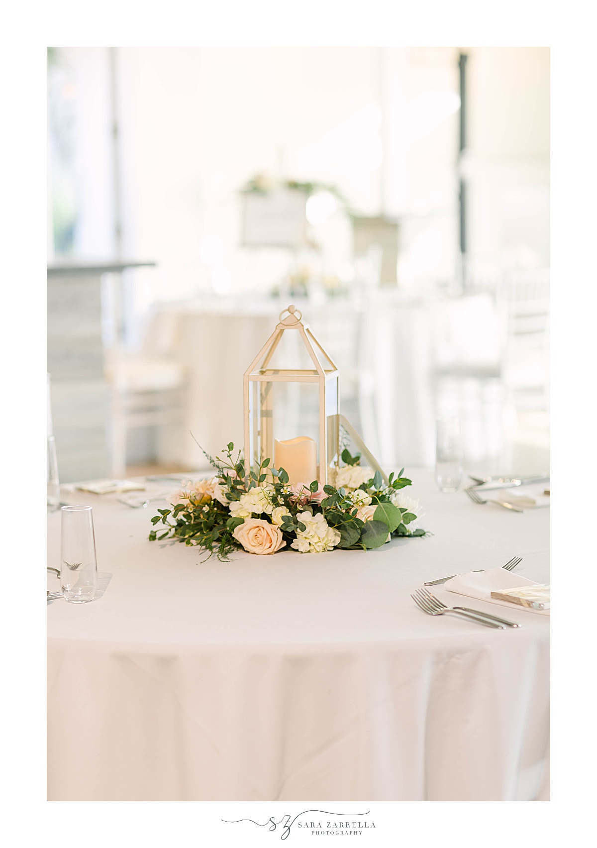 lantern centerpieces with pastel florals for oceanside wedding