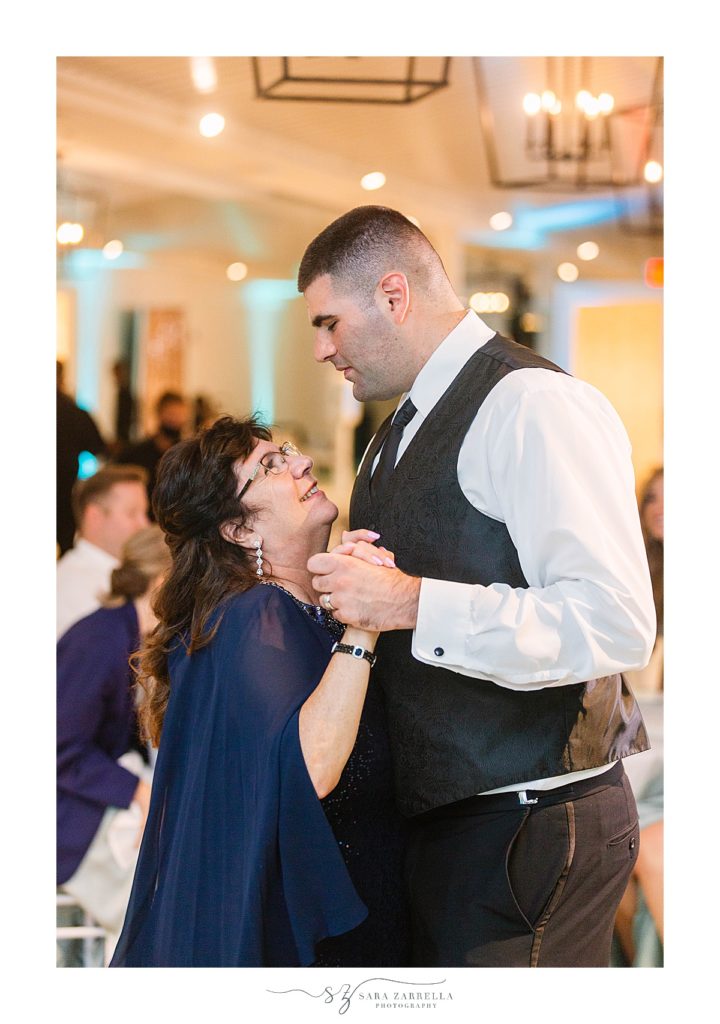 groom dances with mother at Newport Beach House wedding reception