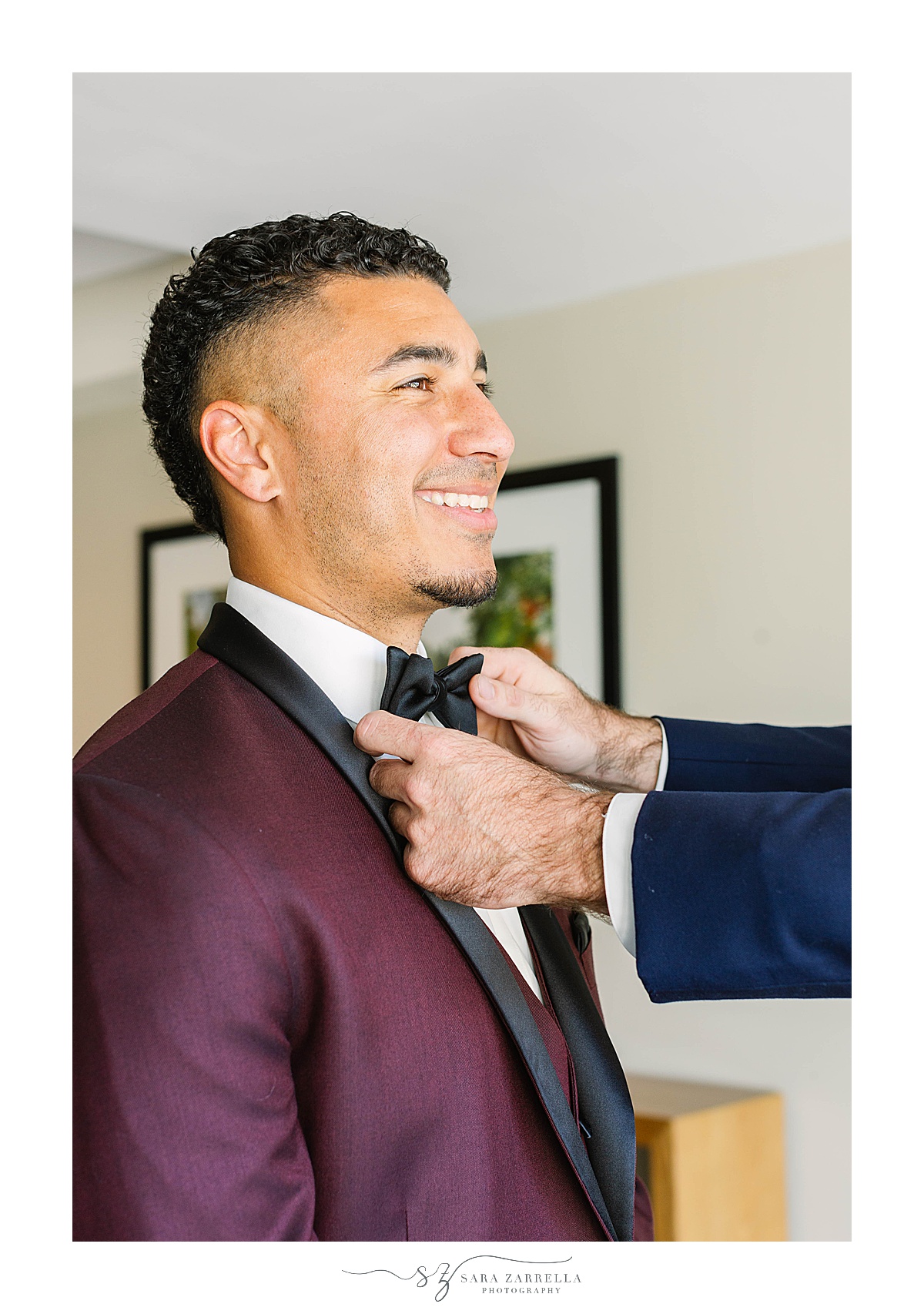 groomsman adjusts groom's tie before Atlantic Resort Newport Wedding