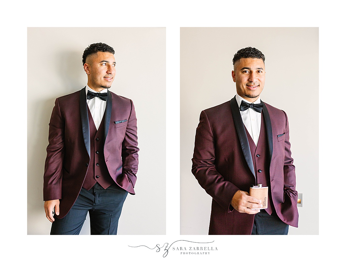 groom in burgundy suit poses before Atlantic Resort Newport Wedding