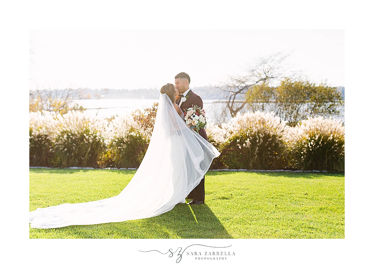 bride and groom kiss after first look before Atlantic Resort Newport Wedding