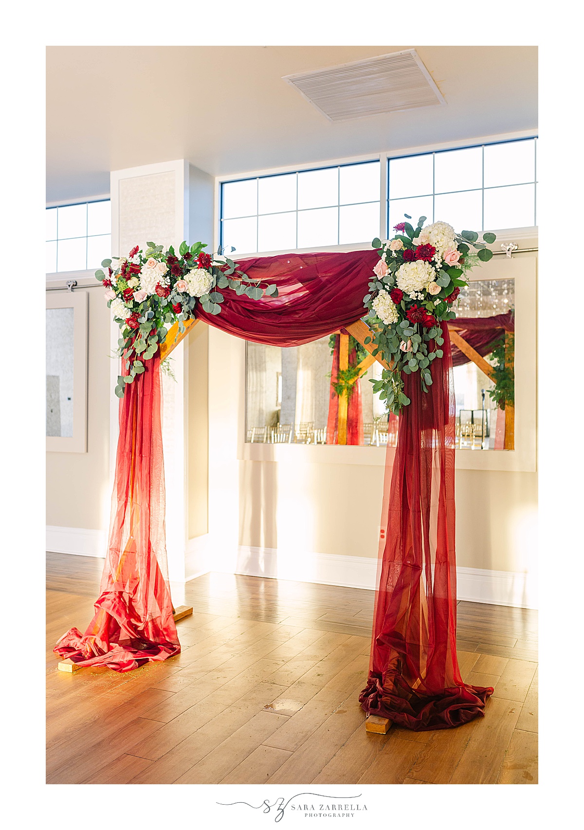 draped arbor with florals for fall Atlantic Resort Newport Wedding