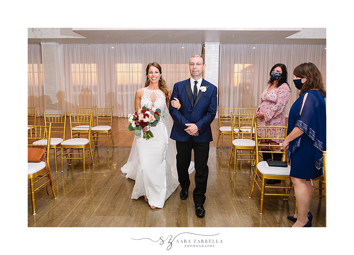 bride walks down aisle at Atlantic Resort Newport