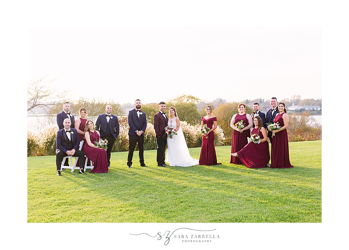 bridal party poses on the lawn at Atlantic Resort Newport