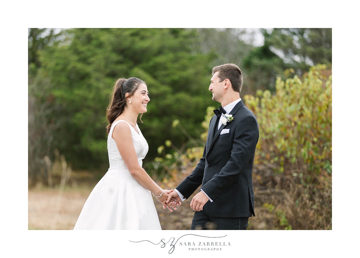 first look by Castle Hill Lighthouse on Rhode Island wedding day