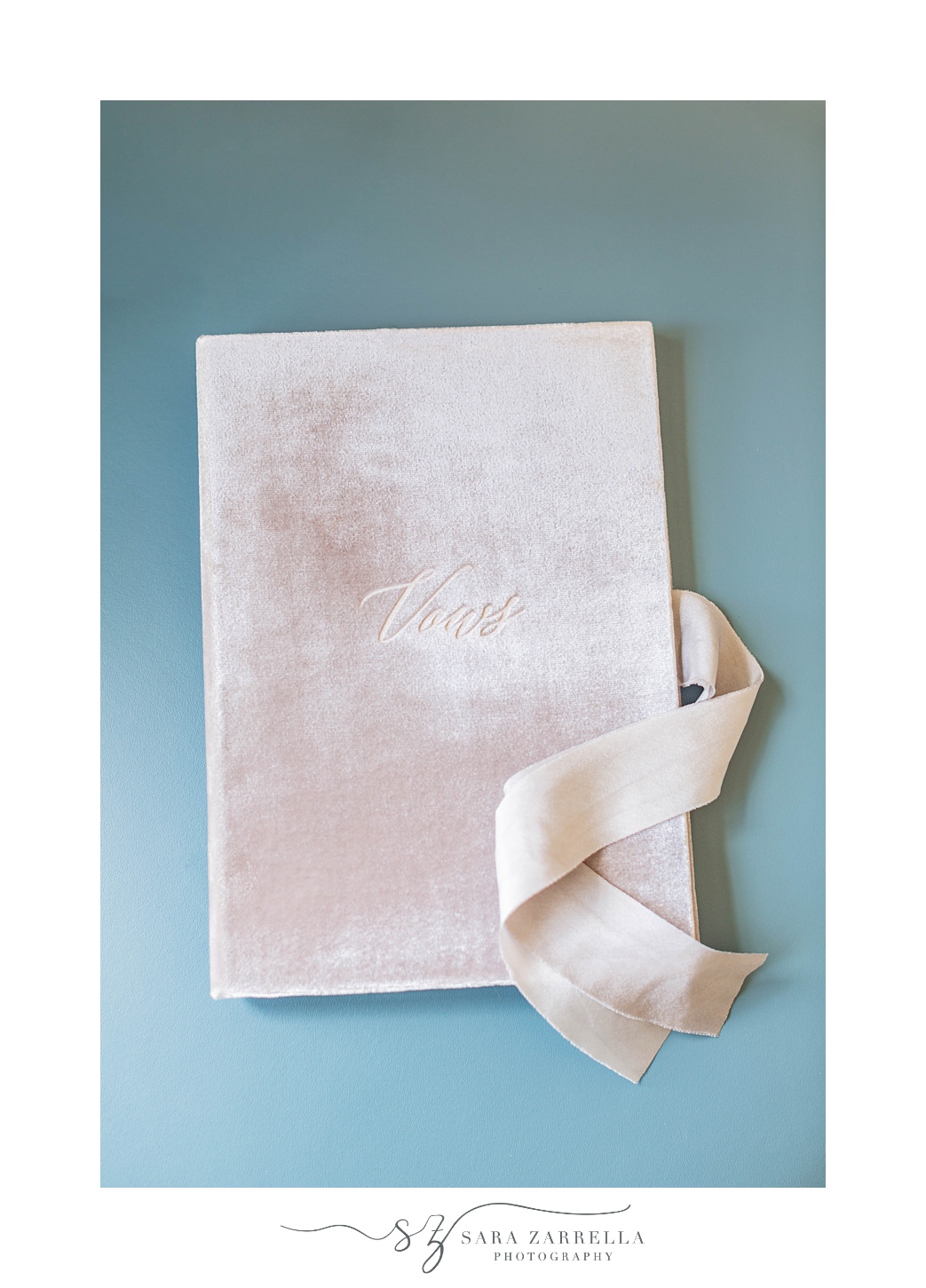 vow booklet photographed on blue styling mat by Rhode Island wedding photographer