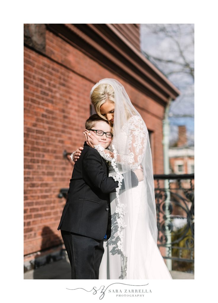 bride hugs son during first look in Rhode ISland