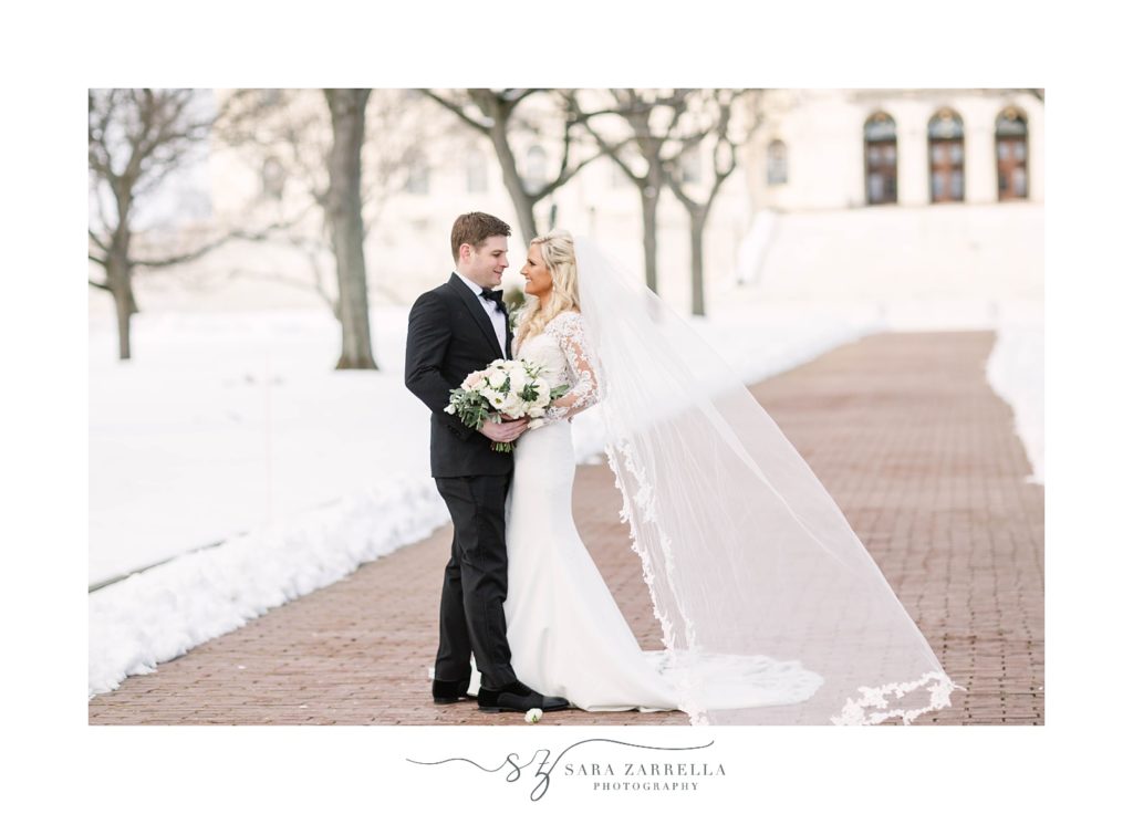 winter wedding portraits of bride and groom by Providence RI State House
