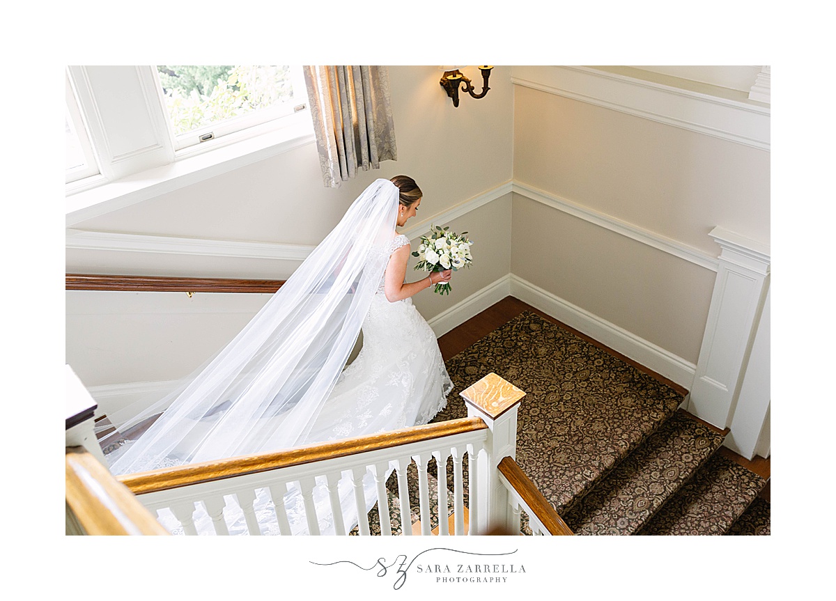bride walks down staircase at OceanCliff Hotel