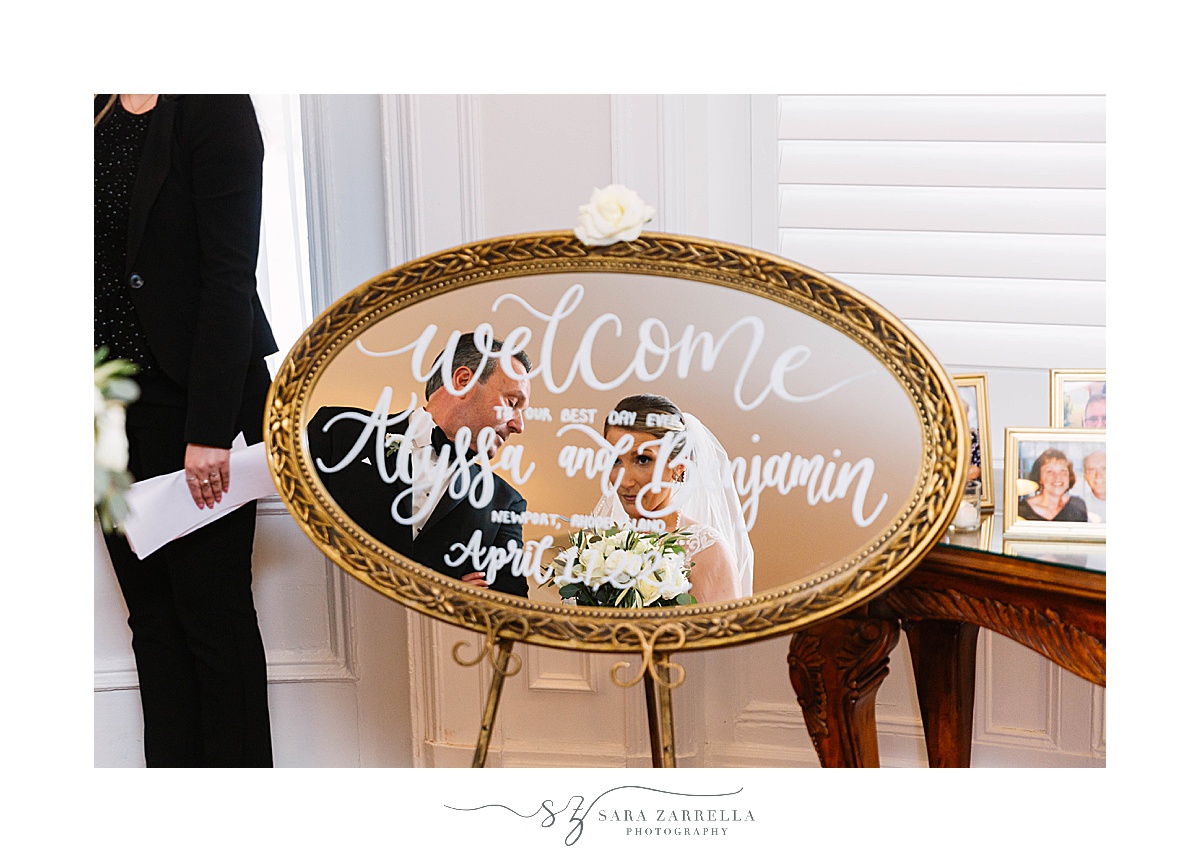welcome sign on gold mirror with white lettering 