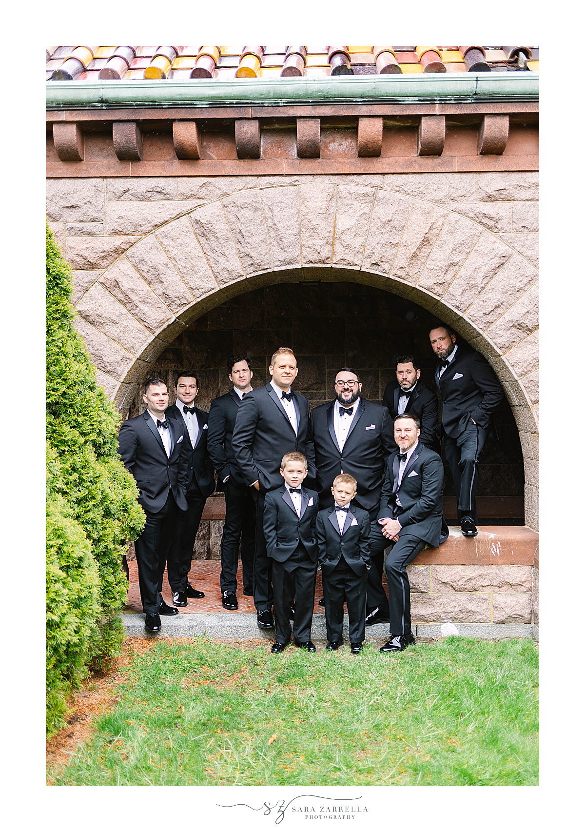 portraits of groom and groomsmen in classic black tuxes