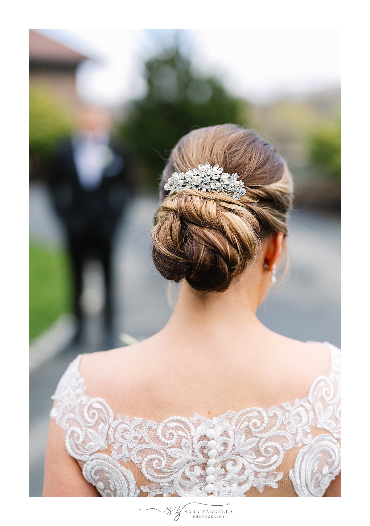 bride shows off classic updo during OceanCliff Hotel wedding portraits 