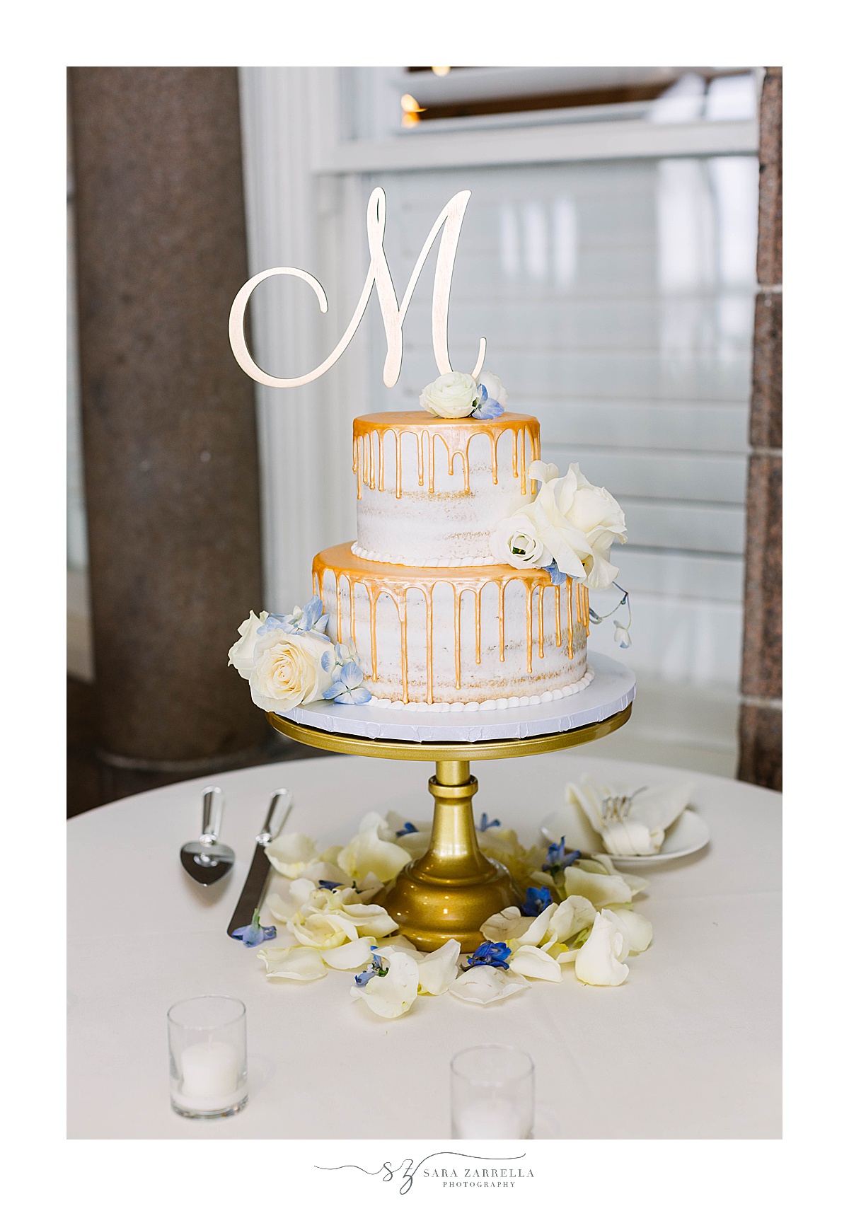 tiered wedding cake with gold drip icing