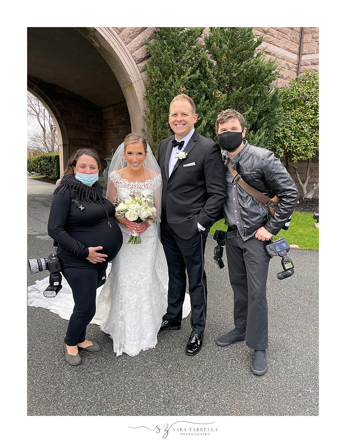 couple poses with Rhode Island wedding photography team