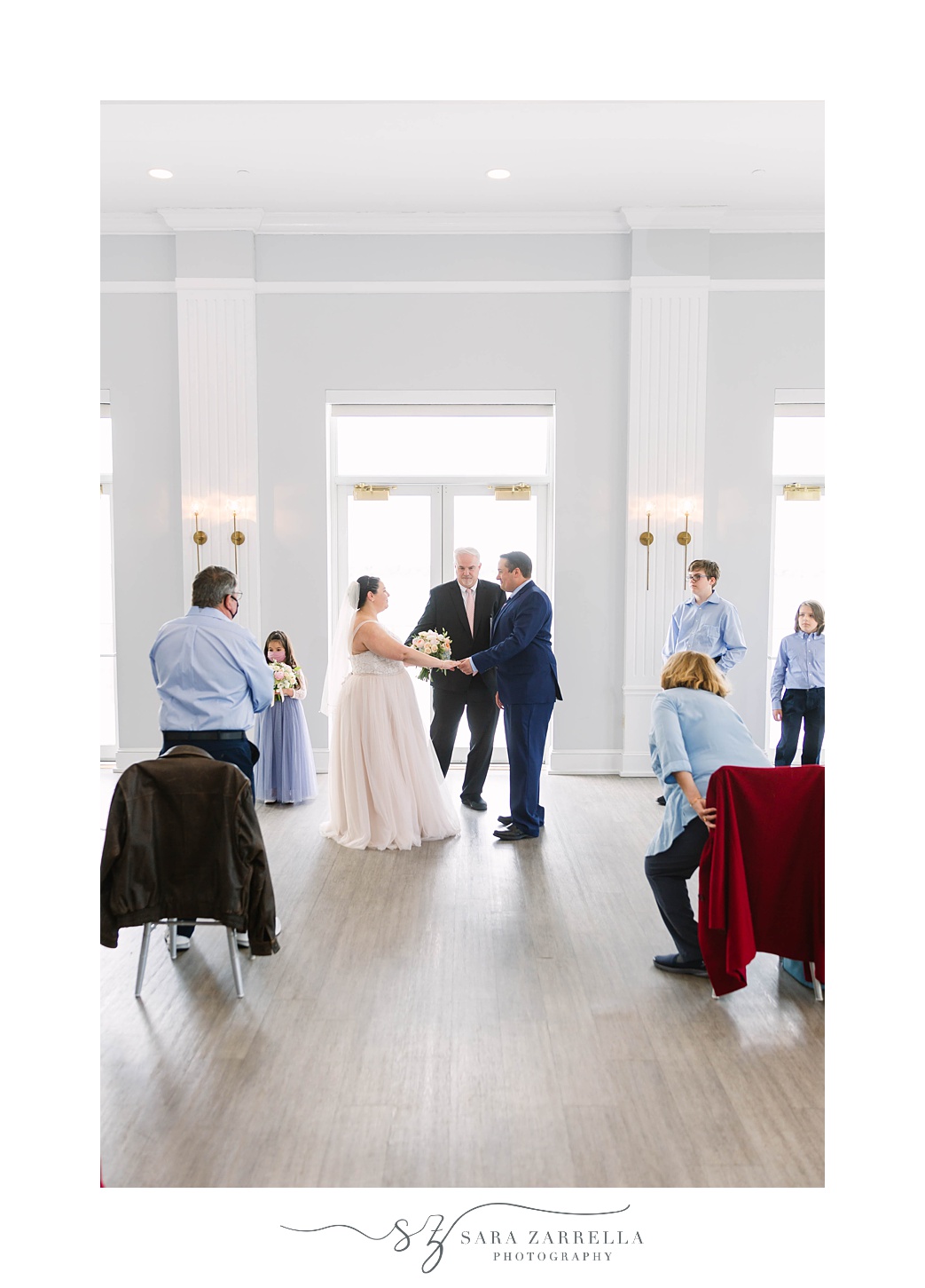 bride and groom exchange vows during intimate Gurney's Newport Resort wedding