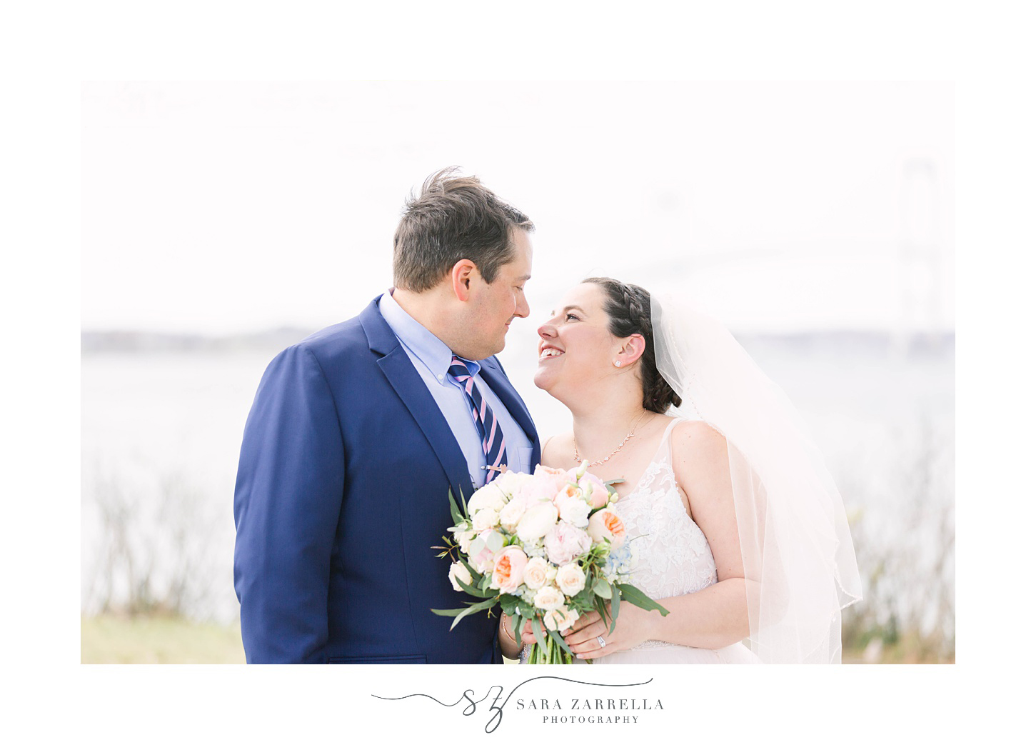 bride and groom smile at each other during Rhode Island wedding photos