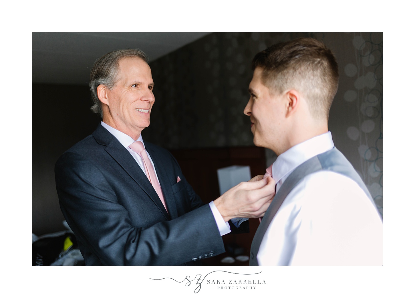 father helps groom with tie before Kirkbrae Country Club wedding