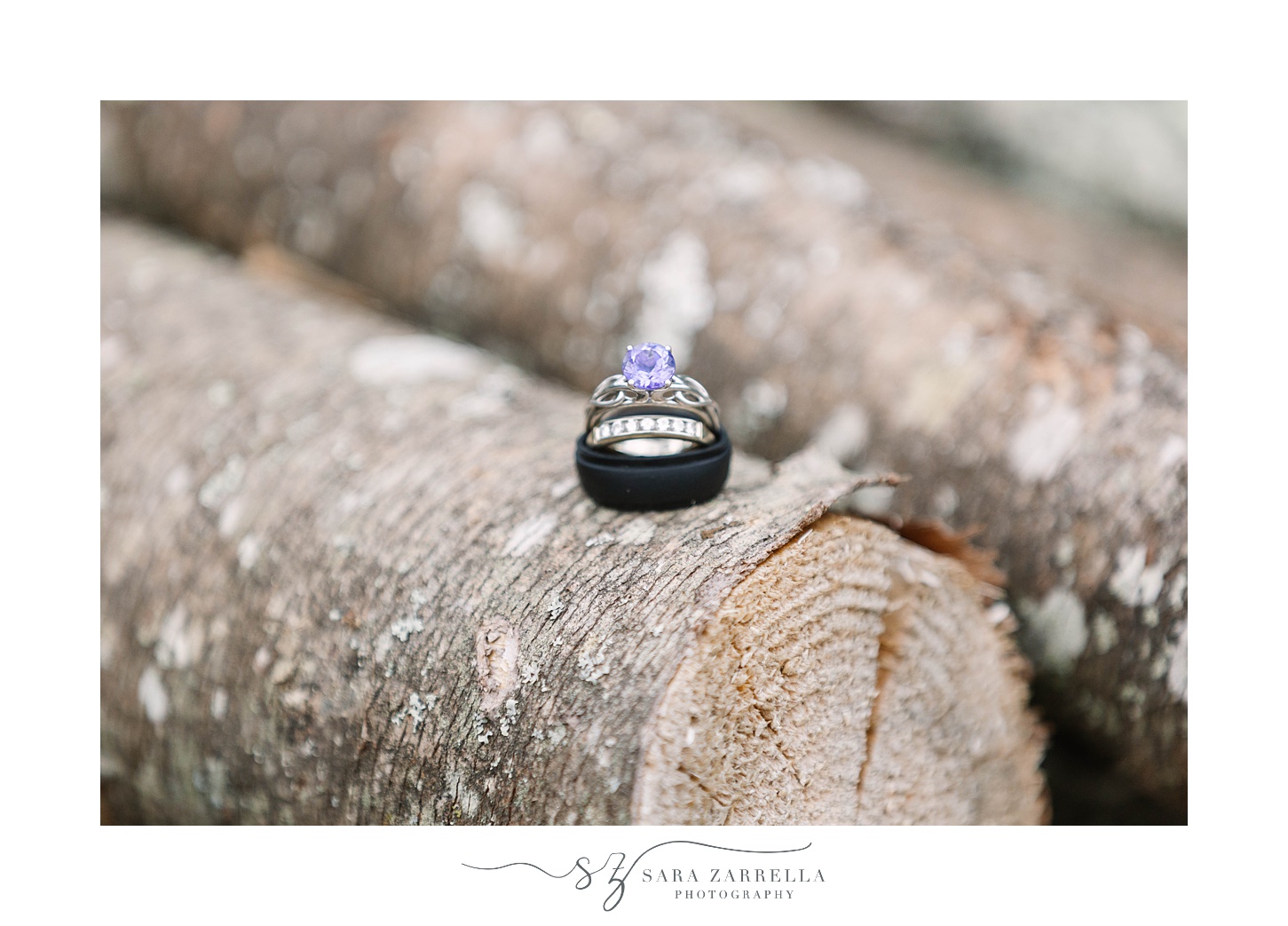 wedding rings rest on wooden long 