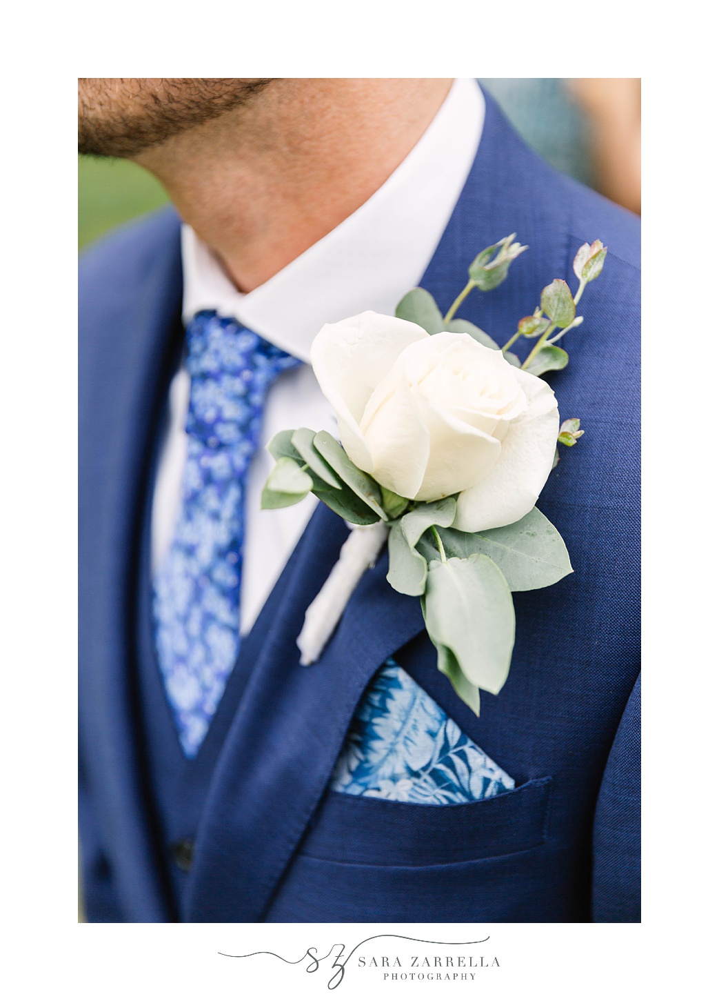 white rose boutonniere for groom