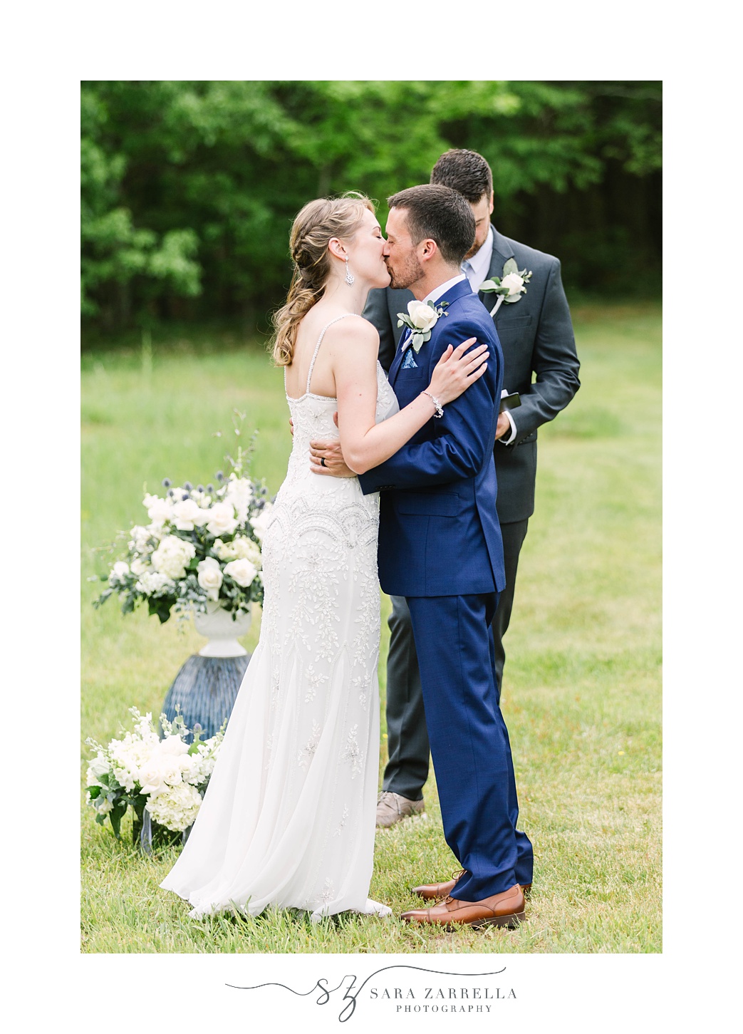 bride and groom kiss during  intimate backyard wedding ceremony