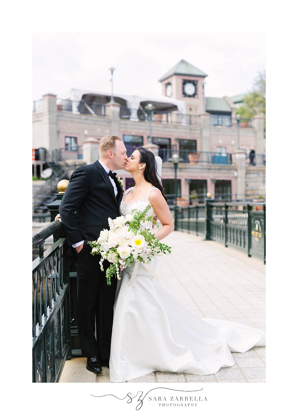 bride and groom kiss outside Skyline at Waterplace