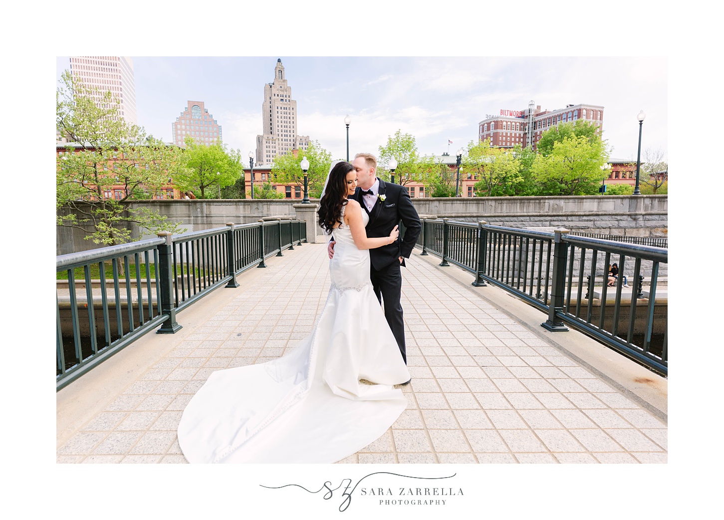 newlyweds stand on bridge in Providence RI